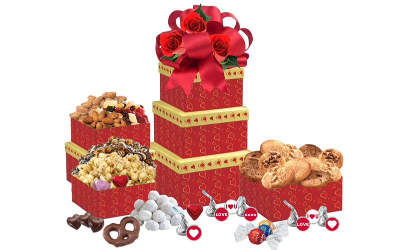 Image Red Heart gift boxes topped with silk roses and ribbon filled with cookies, chocolate, popcorn, nuts and savory treats