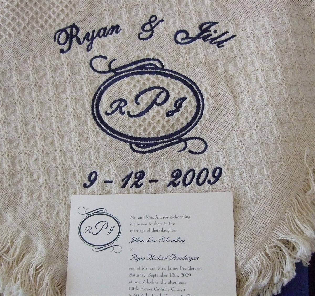 Monogram from wedding invitaion on blanket