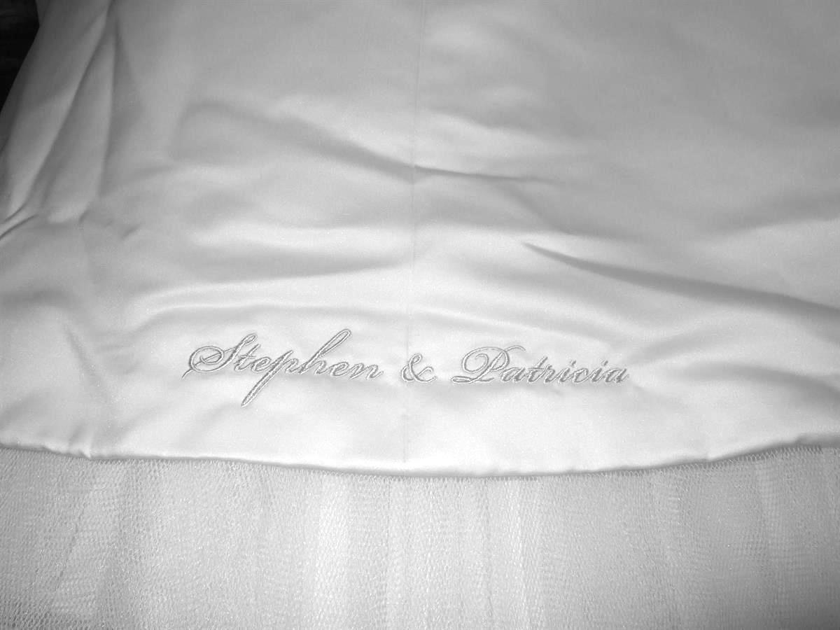 Bride and groom's names on bottom of dress