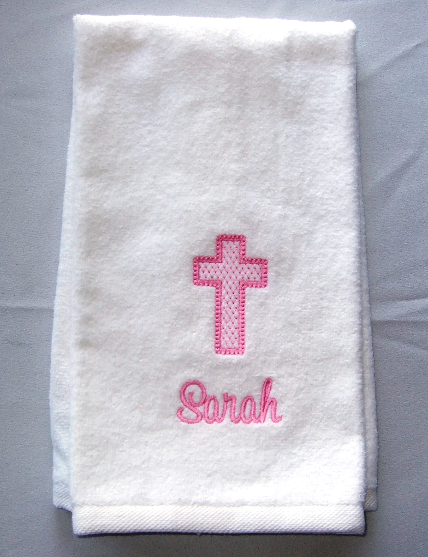 Baptismal towel with pink light fill cross and baby's name